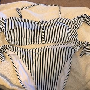 Two piece bathing suit with ties on the arms